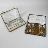 An early 20th century silver manicure set, cased, together with a set of silver teaspoons,