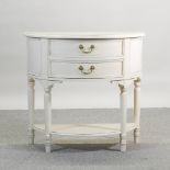 A Laura Ashley cream painted D shaped chest,