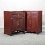 A near pair of Chinese red painted bedside cabinets,