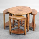 A nest of five Art Deco walnut circular occasional tables,