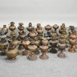 A large collection of various oil lamps,