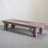 A painted and metal mounted coffee table,
