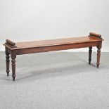 A Regency style oak window seat, on turned legs,