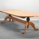 A very large light oak twin pillar dining table,