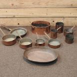 A collection of antique copper pans and metalwares