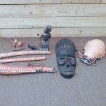 Two boxes of wooden tribal carvings, to include a mask,
