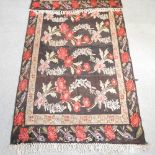 A Turkish kelim rug, with floral design, on a blue ground,