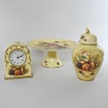 An Aynsley Orchard Gold pattern porcelain mantel clock, together with two pieces of Aynsley,