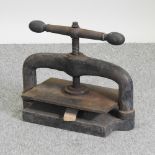 An antique cast iron book press,