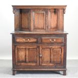 A 19th century and later oak court cupboard, enclosed by panelled doors, 123cm.