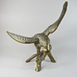 A brass model of an eagle,