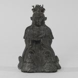 A bronze figure of an Asian buddha, seated,