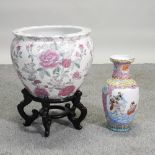 A Chinese porcelain jardiniere, on a wooden stand, 49cm high overall,