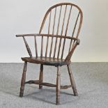 A 19th century fruitwood spindle back armchair