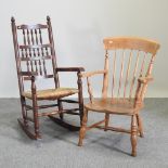 A Norfolk rush seated spindle back rocking chair,