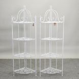 A pair of white painted metal corner racks,