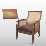 A Regency teak and mahogany single cane bergere library armchair,