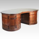 An unusually large early 20th century German walnut kidney shaped pedestal desk,