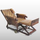 A Victorian brown leather upholstered patent reclining wing armchair,