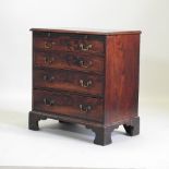 A George III mahogany bachelor's chest, fitted with a brushing slide,