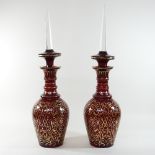 A pair of unusually large early 20th century continental ruby glass jars and stoppers,