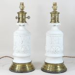 A pair of Parian porcelain table lamp bases, each with moulded Grecian decoration,