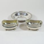 A pair of George III silver open salts, each of boat shape, with a gadrooned border, on ball feet,