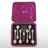 A set of six 19th century gilt coffee spoons, with a pair of matching sugar tongs,