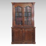 A dark oak glazed cabinet bookcase, having a fitted interior,