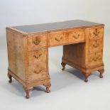 Withdrawn - A reproduction walnut pedestal desk, of Queen Anne style, with an inset writing surface,