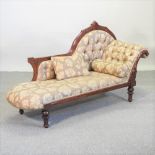 A Victorian style mahogany and brown floral upholstered chaise longue,