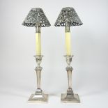 A pair of Edwardian silver ejector table candlesticks, each of square shape, Sheffield 1909,