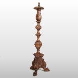 A Venetian style carved wooden floor standing lamp, decorated with scrolls,