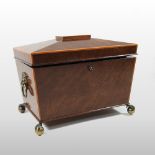 A Regency mahogany and boxwood strung tea caddy, of sarcophagus shape, with a hinged lid,
