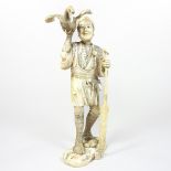 A late 19th century Japanese carved ivory figure of a boatman, Meiji period,