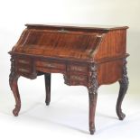 An early 20th century French rosewood bureau, with an s shaped hinged fall,