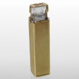 A cut glass ladies pocket scent bottle and stopper, contained in a 9 carat gold case,