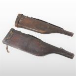 An early 20th century leather gun case, of leg of mutton shape, together with another, 80cm (2).