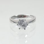 An 18 carat white gold diamond solitaire ring, approximately 0.