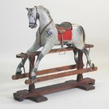 An early 20th century painted wooden rocking horse, by Ayres,