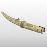 A late 19th century Japanese carved bone ceremonial short sword, Meiji Period, the sectional handle,
