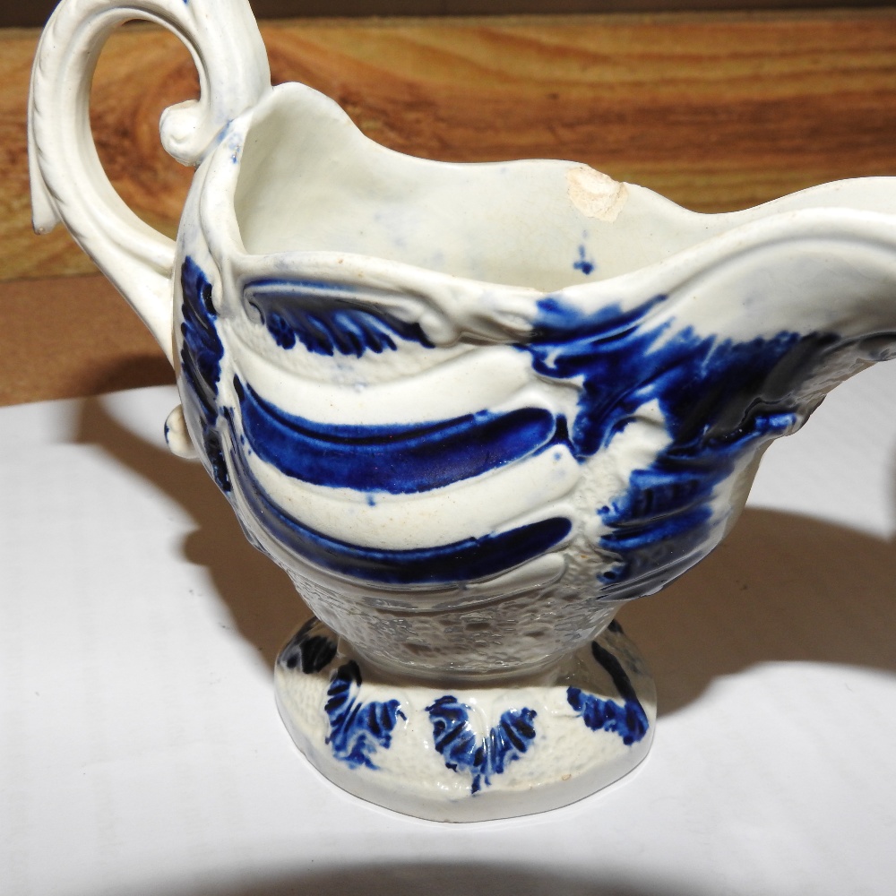 An 18th century Staffordshire blue and white pearlware jug, c1770, of scrolled helmet shape, - Image 6 of 7