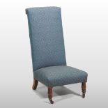 A 19th century blue upholstered prie dieu chair, on turned legs and castors,