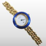 A Gucci 1980's ladies gold plated wristwatch, having a signed white dial, on a bracelet strap,