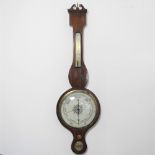 A 19th century rosewood cased wheel barometer, having a swan neck pediment, inset with three dials,