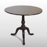 A George III and later mahogany occasional table, the hinged circular top,