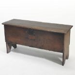 An 18th century oak six plank coffer, with a hinged lid,