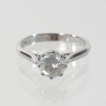 An 18 carat white gold diamond solitaire ring, approximately 0.
