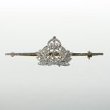 An early 20th century 14 carat gold and platinum set brooch, set with thirty-five diamonds,