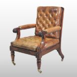 A Regency mahogany and leather upholstered library armchair, having a buttoned back and seat,